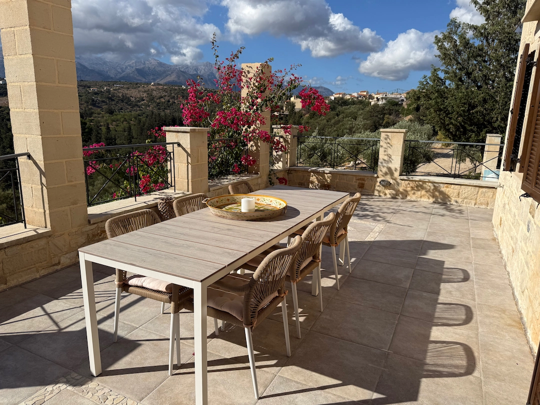 Terrace dining area with bougainvillea